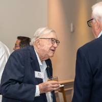 President Emeritus Don Lubbers talking with other event guest